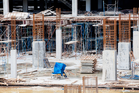 Construction site view of crane, lift, metal beam, brick, metal ladder and concreteの写真素材