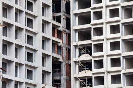Construction site view of crane, lift, metal beam, brick, metal ladder and concreteの写真素材