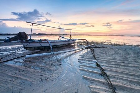 Holiday in Bali, Indonesia - Reflection Sunrise in Tanjong Benoa with boatの写真素材