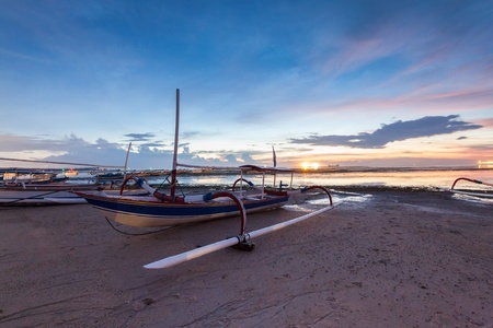 Holiday in Bali, Indonesia - Reflection Sunrise in Tanjong Benoa with boatの写真素材