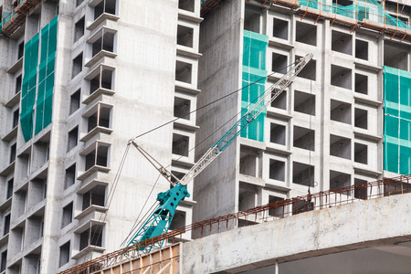 Construction site view of crane, lift, metal beam, brick, metal ladder and concreteの写真素材