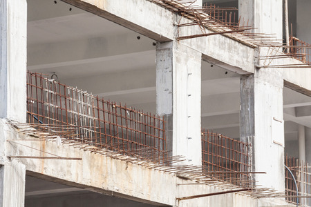 Construction site view of crane, lift, metal beam, brick, metal ladder and concreteの写真素材