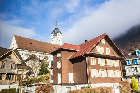 Holiday in Switzerland - Beautiful foggy view of winter landscape towards Engelberg, Switzerlandのeditorial素材