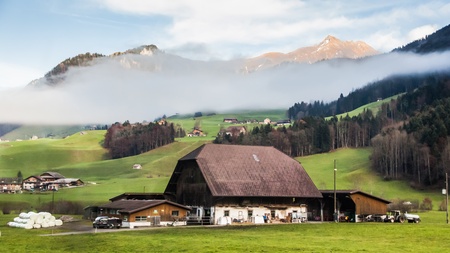 Holiday in Switzerland - Beautiful foggy view of winter landscape towards Engelberg, Switzerlandのeditorial素材