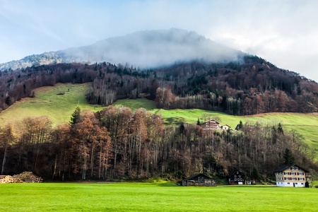 Holiday in Switzerland - Beautiful foggy view of winter landscape towards Engelberg, Switzerlandの写真素材