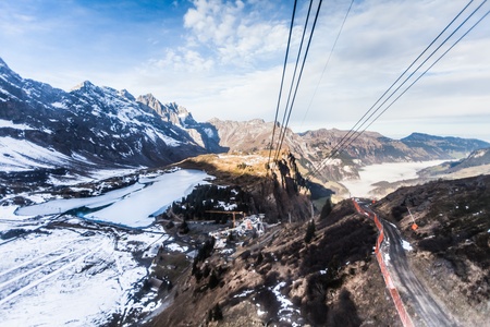 Holiday in Switzerland - Beautiful foggy view of winter landscape view of Engelberg from Mount Titlis Switzerlandの写真素材