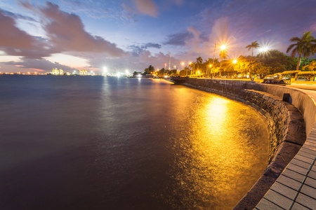 Sunrise yellow cloud and blue sky view seascape in Esplanade, George Town, Penang, Malaysiaの写真素材
