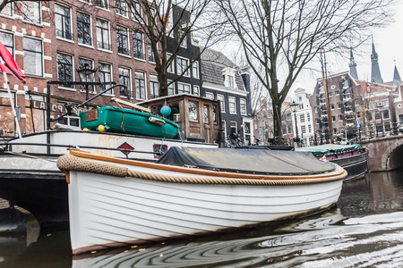 Amsterdam Holland, 4 December 2014 : Canal Cruises view of Amsterdam. Amsterdam is the Netherlandsâ capital, known for its artistic heritage, elaborate canal system and narrow houses with gabled facades, legacies of the cityâs 17th-century Golden Age.のeditorial素材
