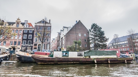 Amsterdam Holland, 4 December 2014 : Canal Cruises view of Amsterdam. Amsterdam is the Netherlandsâ capital, known for its artistic heritage, elaborate canal system and narrow houses with gabled facades, legacies of the cityâs 17th-century Golden Age.のeditorial素材