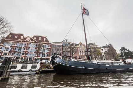 Amsterdam Holland, 4 December 2014 : Canal Cruises view of Amsterdam. Amsterdam is the Netherlandsâ capital, known for its artistic heritage, elaborate canal system and narrow houses with gabled facades, legacies of the cityâs 17th-century Golden Age.のeditorial素材