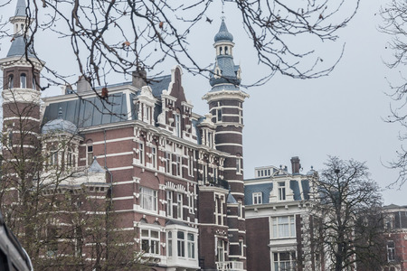 Amsterdam Holland, 4 December 2014 : Canal Cruises view of Amsterdam. Amsterdam is the Netherlandsâ capital, known for its artistic heritage, elaborate canal system and narrow houses with gabled facades, legacies of the cityâs 17th-century Golden Age.のeditorial素材