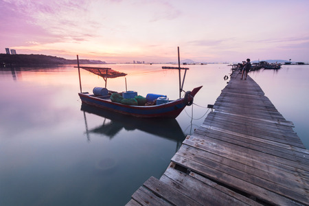 Water overflow on a broken wooden bridgeの写真素材
