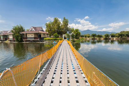 Water overflow on a broken wooden bridgeの写真素材