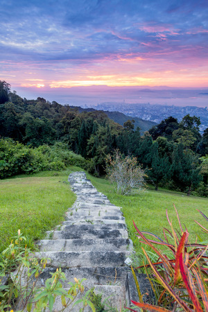 Metropolitan cityscape view from top of the hill or mountain during sunrise sunset