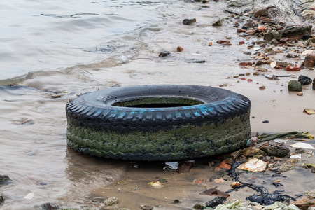Old tire indicating breeding ground for mosquitoの写真素材