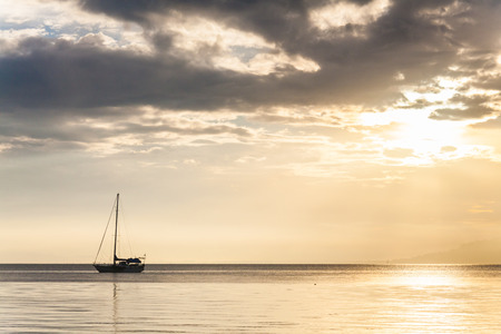 Lonely boat in a calm sea for backgroundの写真素材