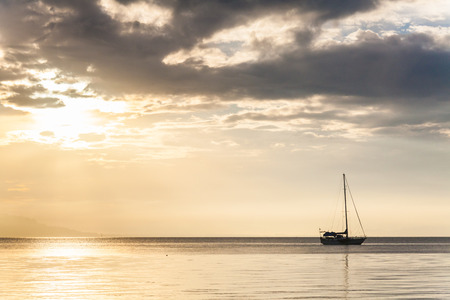 Lonely boat in a calm sea for backgroundの写真素材