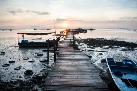 Wooden bridge sunrise for backgroundの写真素材