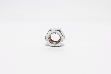 Used old bolts and nuts with isolated white background for commercialの写真素材