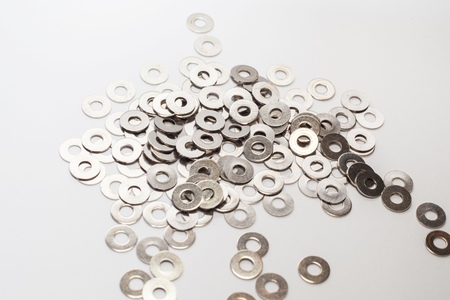 Used old washers and spring washers with isolated white background for commercialの写真素材