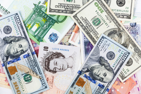 Multi currency note indicating world economy and critical fuel priceの写真素材