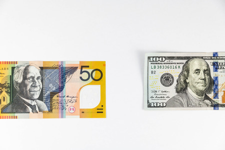 Close up view of US Dollar and Australian Aussie Dollar indicating strong currency exchange rateの写真素材