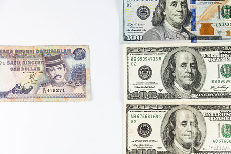 Close up view of US Dollar and Brunei Dollar indicating strong currency exchange rateの写真素材