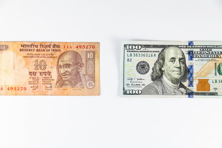 Close up view of US Dollar and India Rupee indicating strong currency exchange rateの写真素材