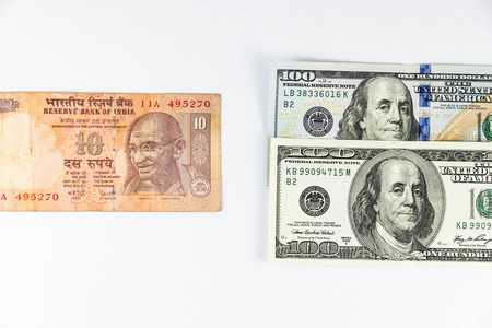 Close up view of US Dollar and India Rupee indicating strong currency exchange rateの写真素材