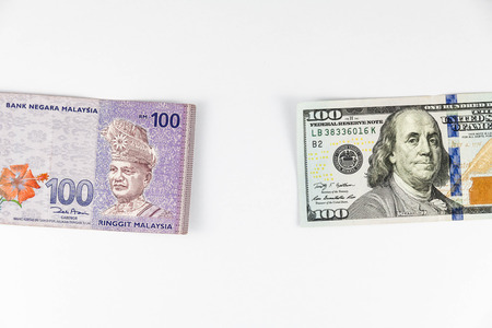 Close up view of US Dollar and Malaysia Ringgit indicating strong currency exchange rate