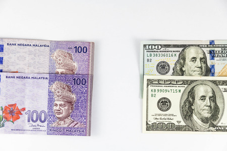 Close up view of US Dollar and Malaysia Ringgit indicating strong currency exchange rateの写真素材