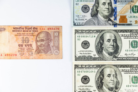 Close up view of US Dollar and India Rupee indicating strong currency exchange rateの写真素材