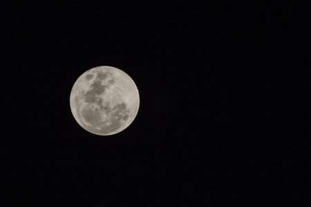 Blur moon with isolated black sky background for text addingの写真素材