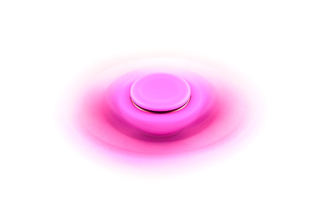 Fidget Spinner in white isolated background for stress release during workの写真素材
