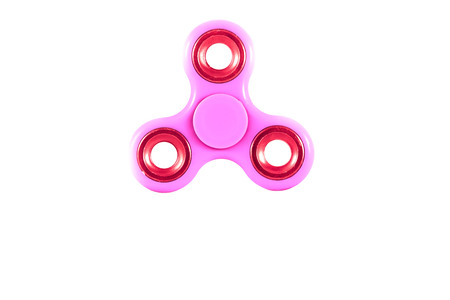 Fidget Spinner in white isolated background for stress release during workの写真素材