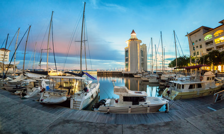 Straits Quay Lighthouse view during sunrise with yachts and boats as foregroundの写真素材