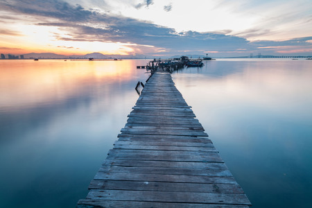 Real wooden bridge view of sunrise backgroundの写真素材