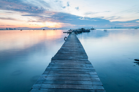 Real wooden bridge view of sunrise backgroundの写真素材
