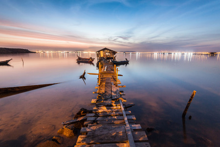 Real wooden bridge view of sunrise backgroundの写真素材