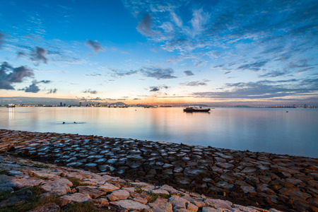 Sunrise or sunset landscape view by the shore for beautiful backgroundの写真素材