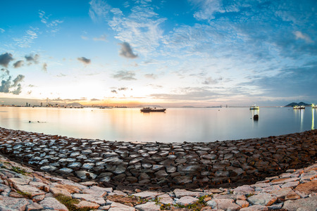 Sunrise or sunset landscape view by the shore for beautiful backgroundの写真素材
