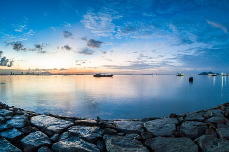 Sunrise or sunset landscape view by the shore for beautiful backgroundの写真素材