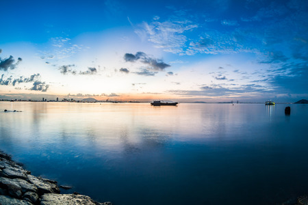 Sunrise or sunset landscape view by the shore for beautiful backgroundの写真素材