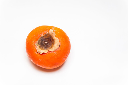 Persimmon view in close up with blur isolated white backgroundの写真素材