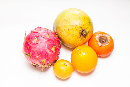 Mixed fruit view in close up with blur isolated white backgroundの写真素材