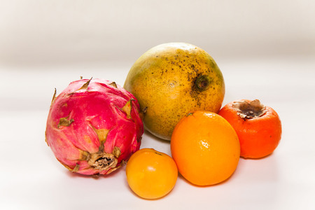 Mixed fruit view in close up with blur isolated white backgroundの写真素材