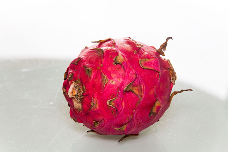 Dragon Fruit view in close up with blur isolated white backgroundの写真素材