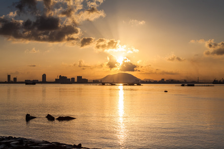 Sunrise or sunset landscape view by the shore for beautiful backgroundの写真素材