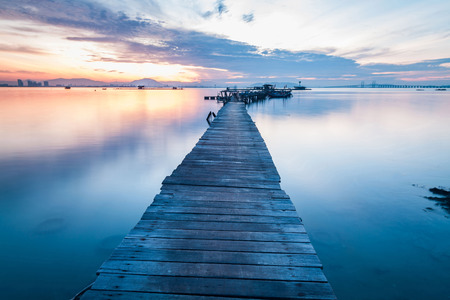 Real wooden bridge view of sunrise backgroundの写真素材