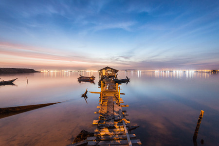 Real wooden bridge view of sunrise backgroundの写真素材